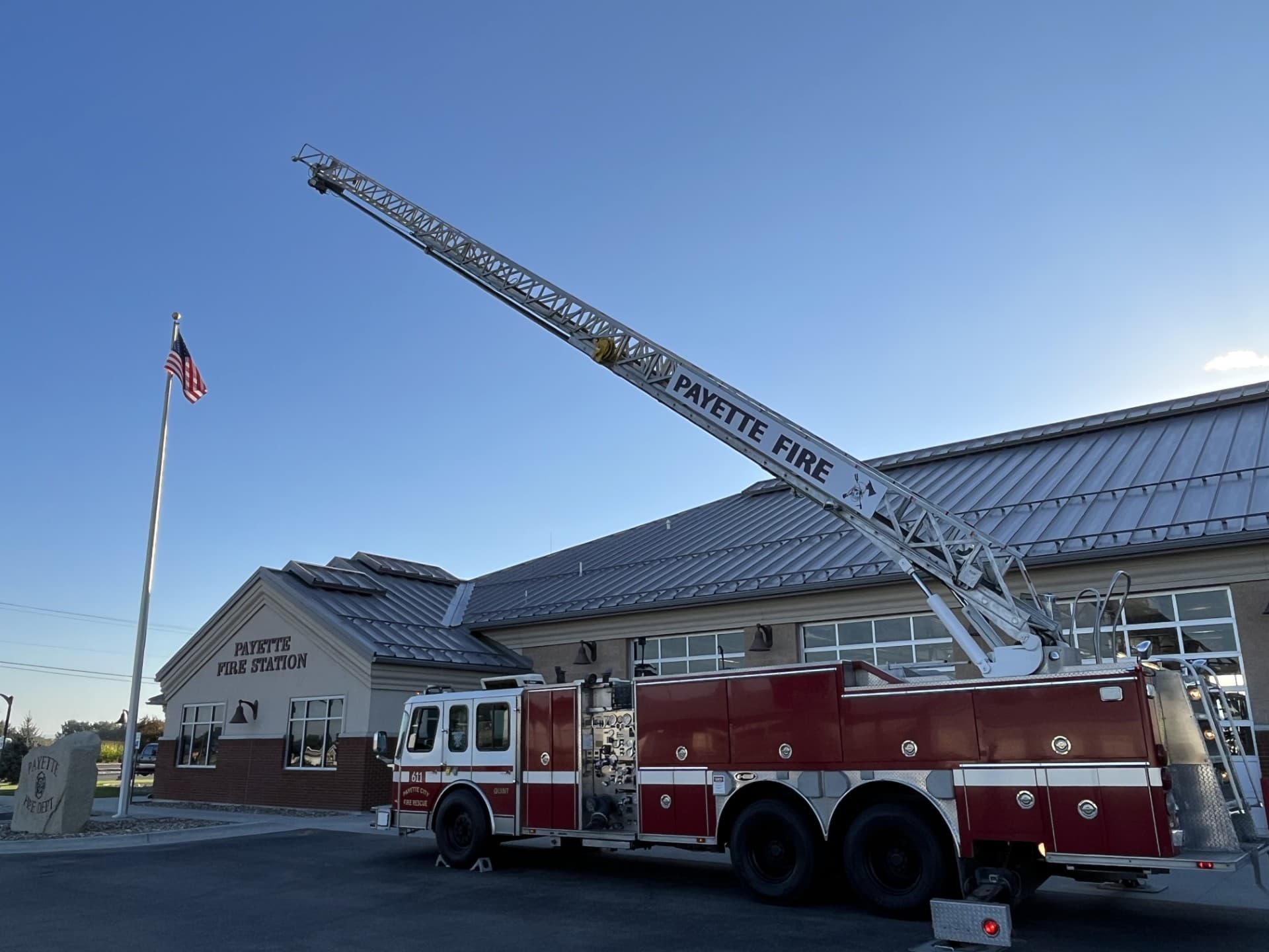 Ladder 611 with its 75-foot aerial extended outside the Payette Fire Station